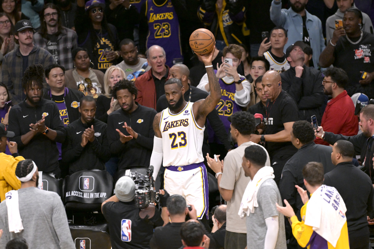 Lebron James held up the ball after making the historic shot.