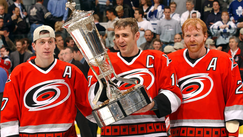 Ron Francis holding a trophy when he was a part of the Caroline Hurricanes when they won the Cup final.